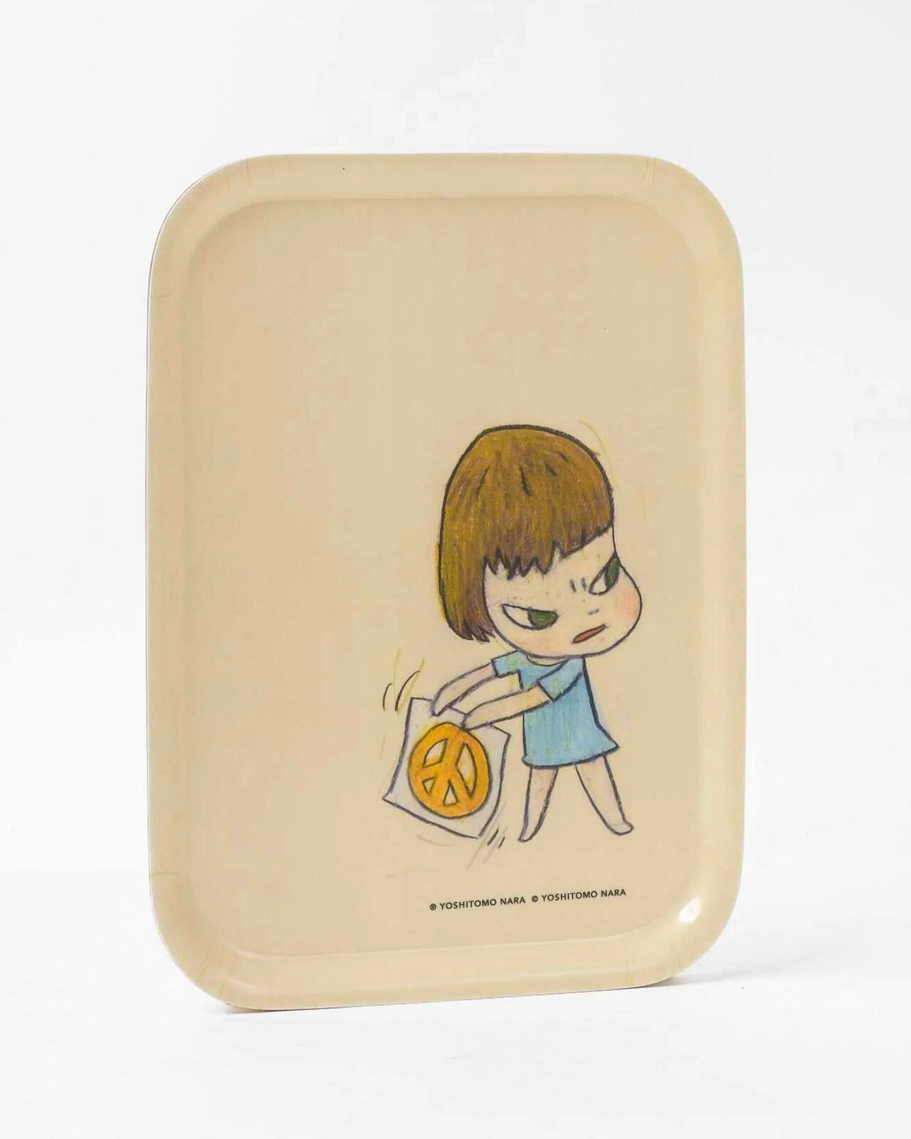 A small tray with a drawing of a little girl holding a peace sign.