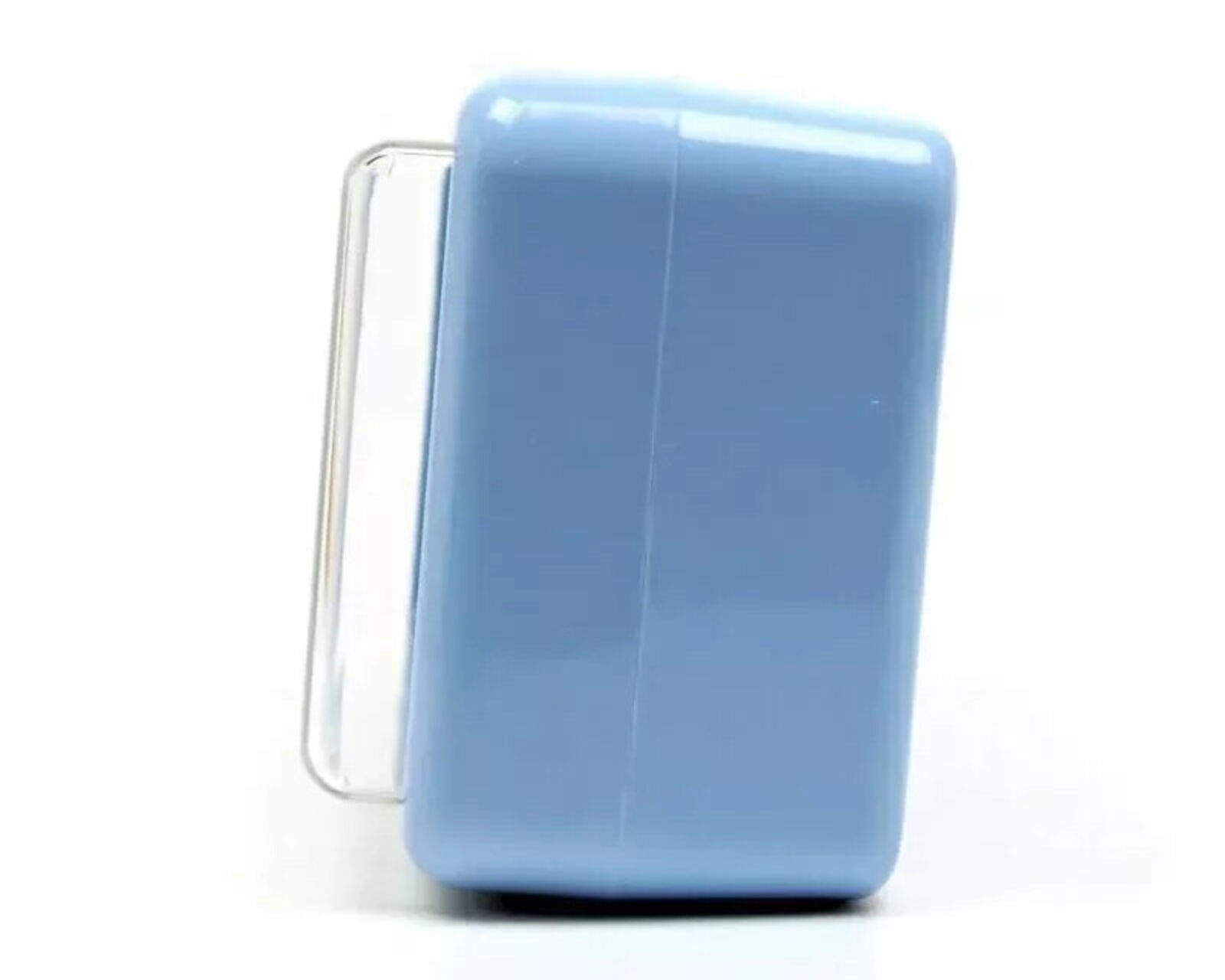 A blue alarm clock with a picture of a boy and a girl on it.