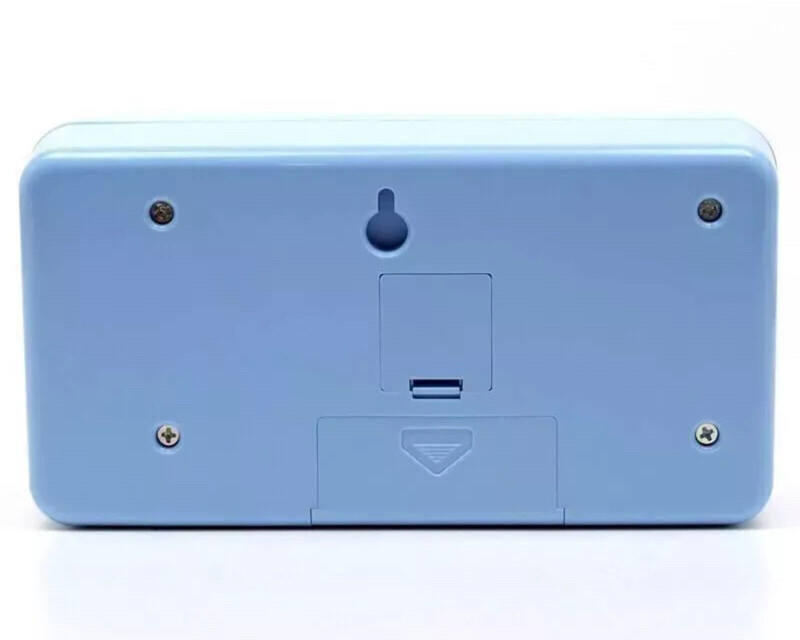 A blue alarm clock with a picture of a boy and a girl on it.