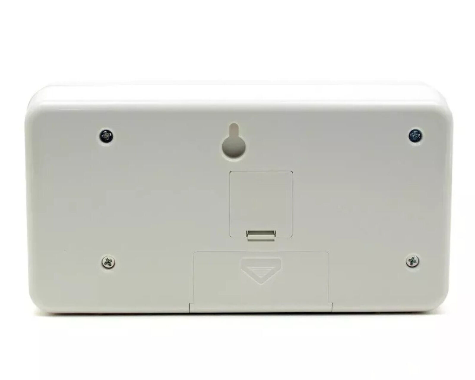 A white alarm clock with a picture of a man and a woman on it.