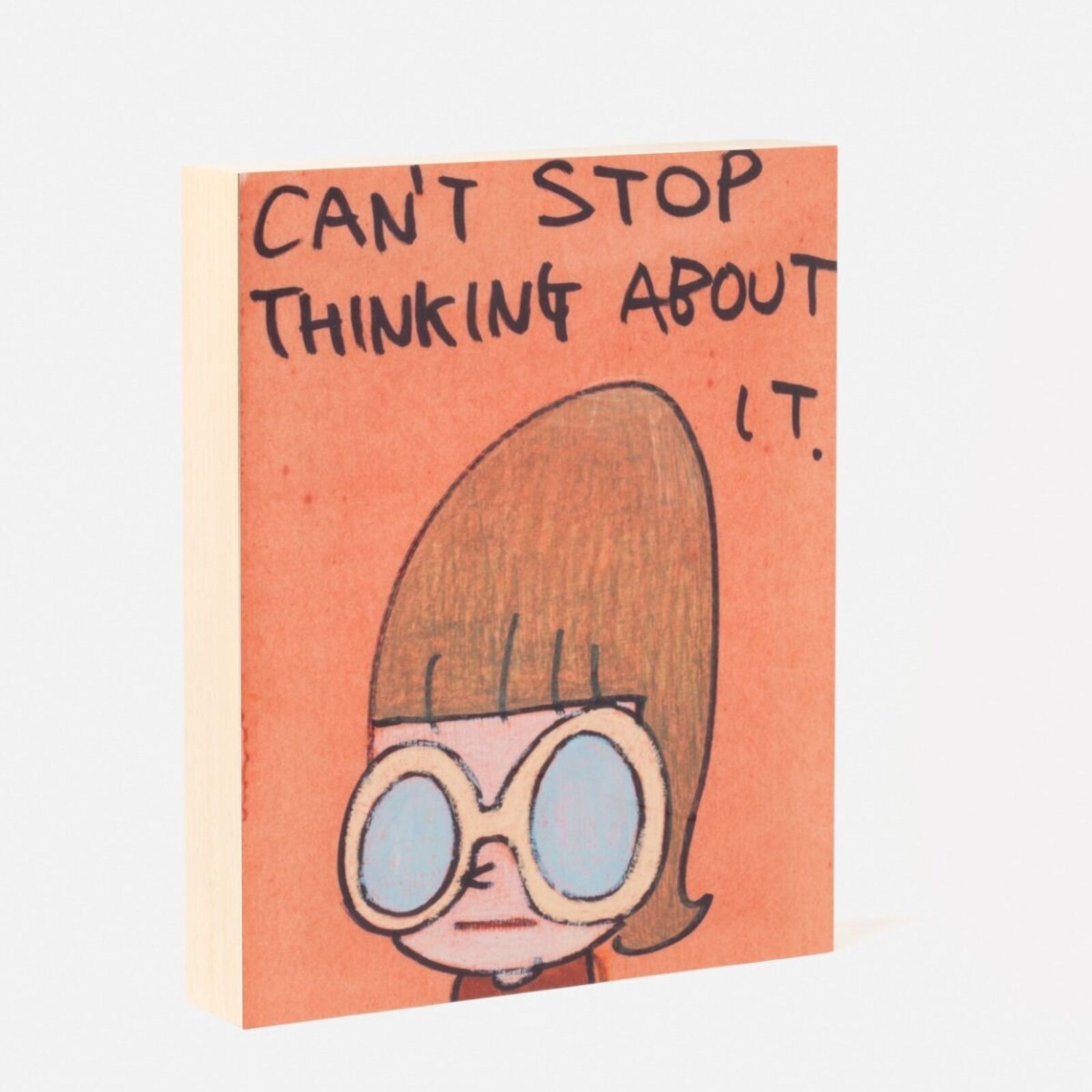 A book with a drawing of a girl wearing sunglasses.