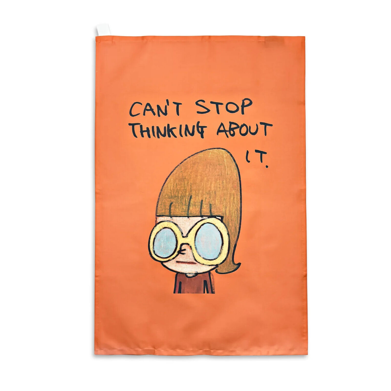 An orange tea towel with a drawing of a girl wearing glasses.