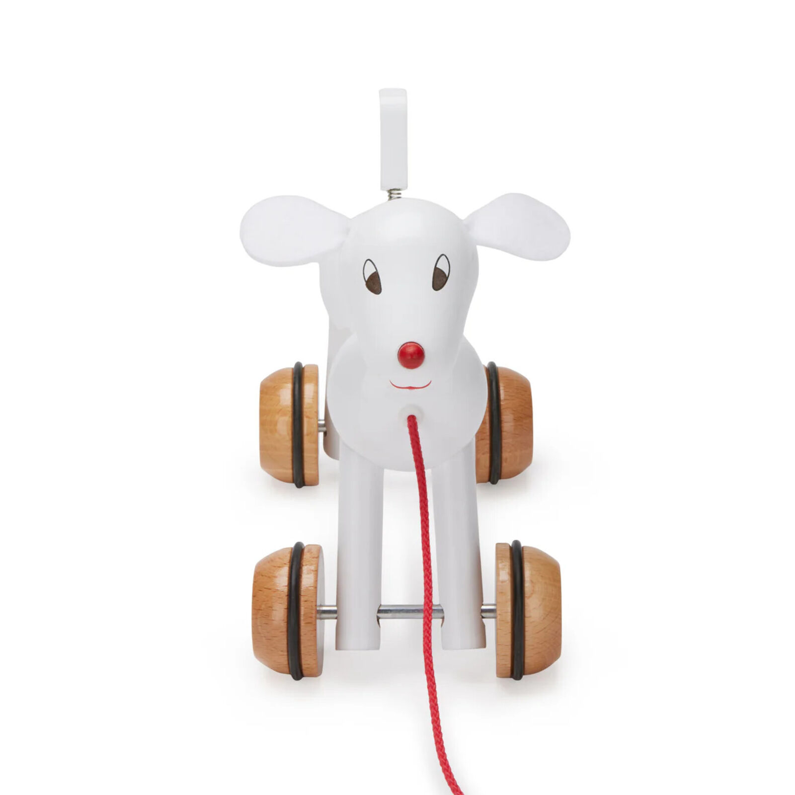 A wooden toy dog pulling a red leash.