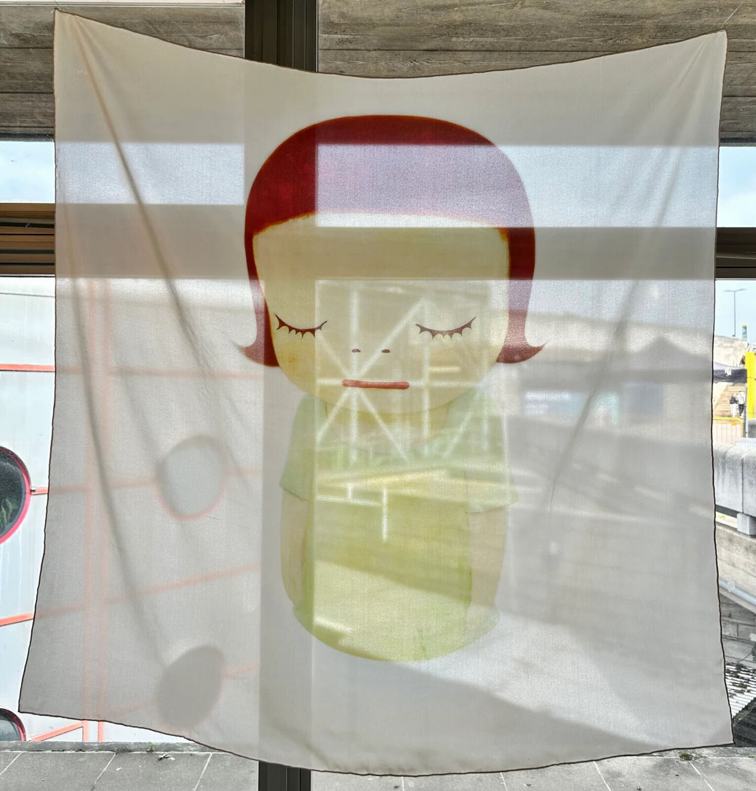 A painting of a little girl with red hair and a green shirt.