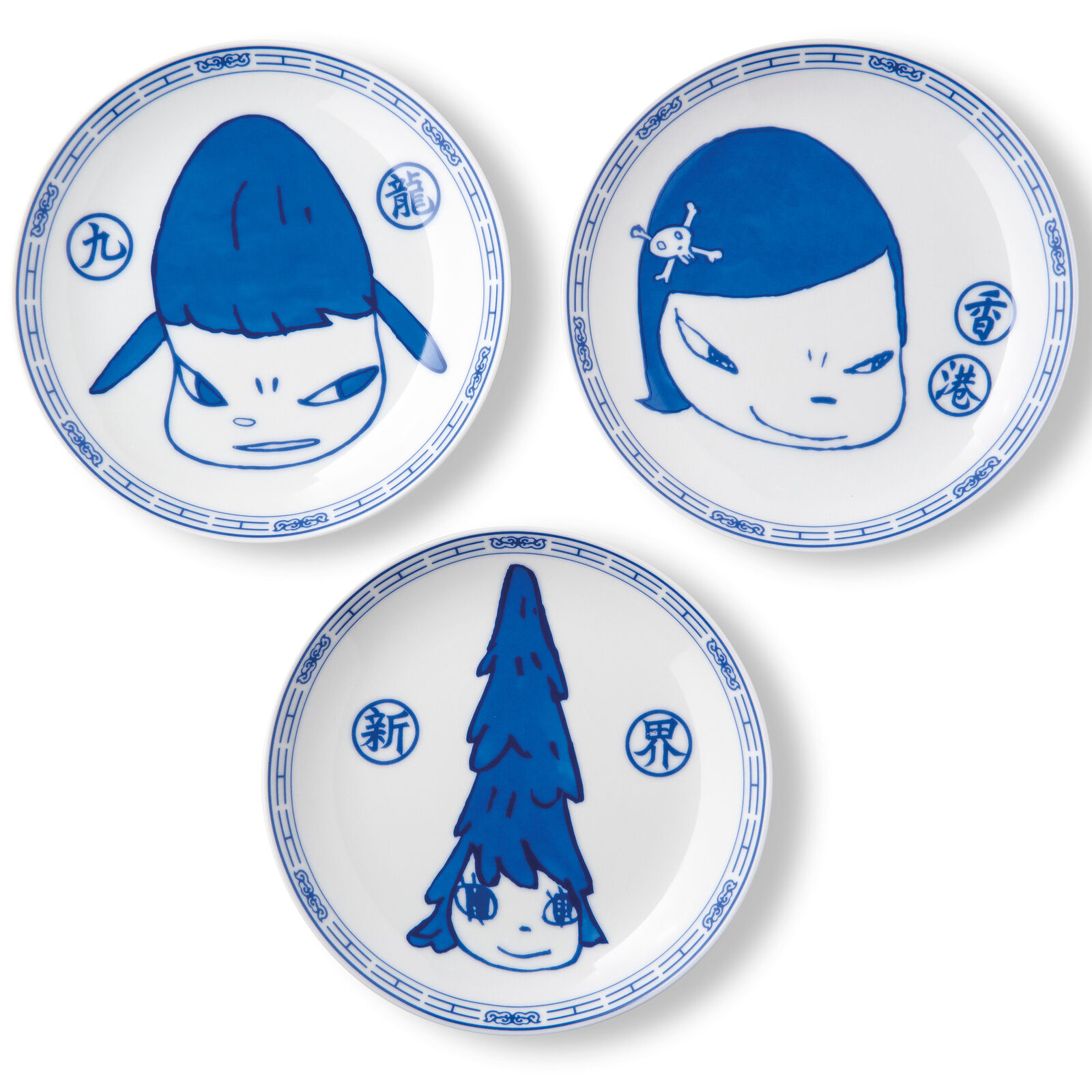 A set of three blue and white plates with cartoon characters on them.