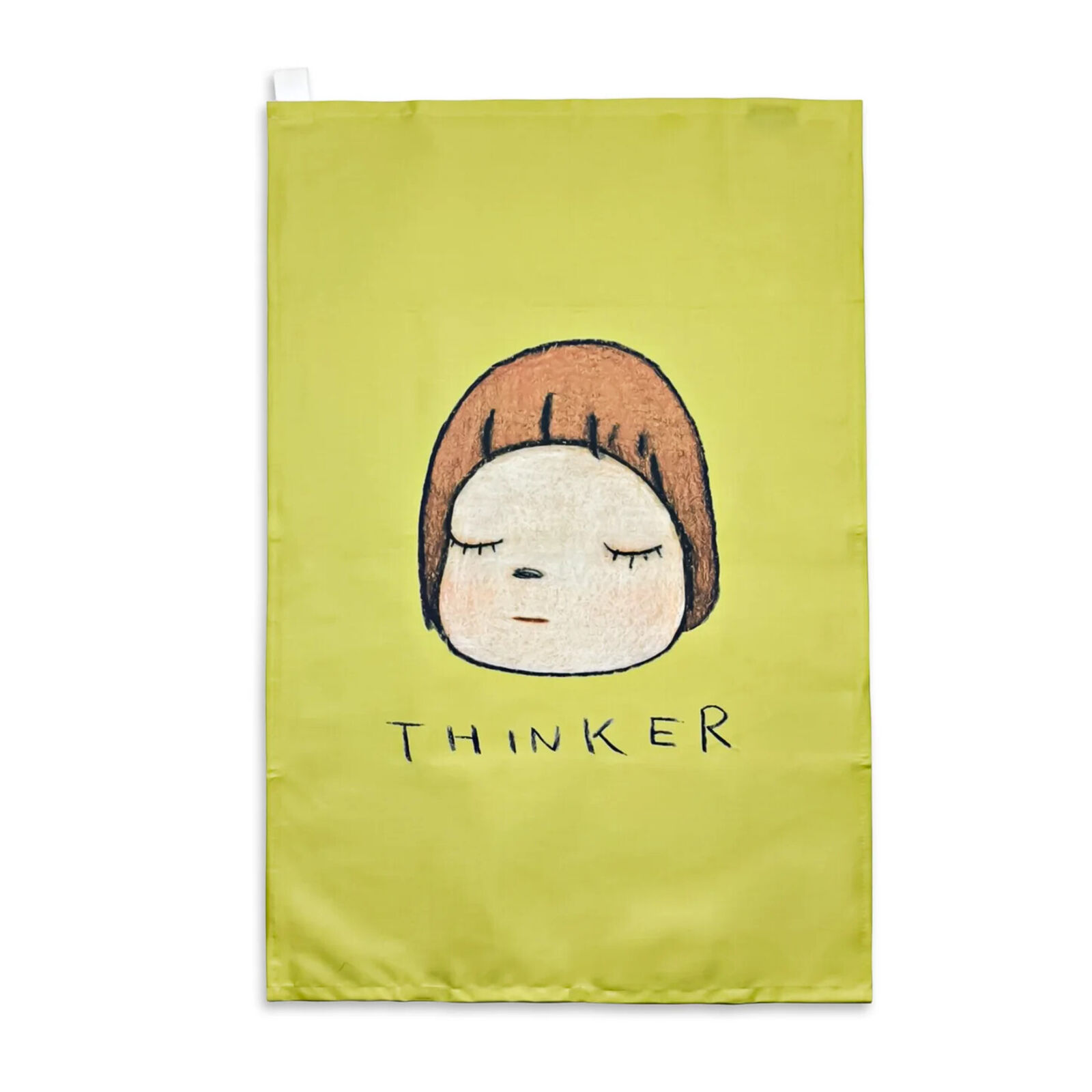 A yellow tea towel with a drawing of a girl's face on it.