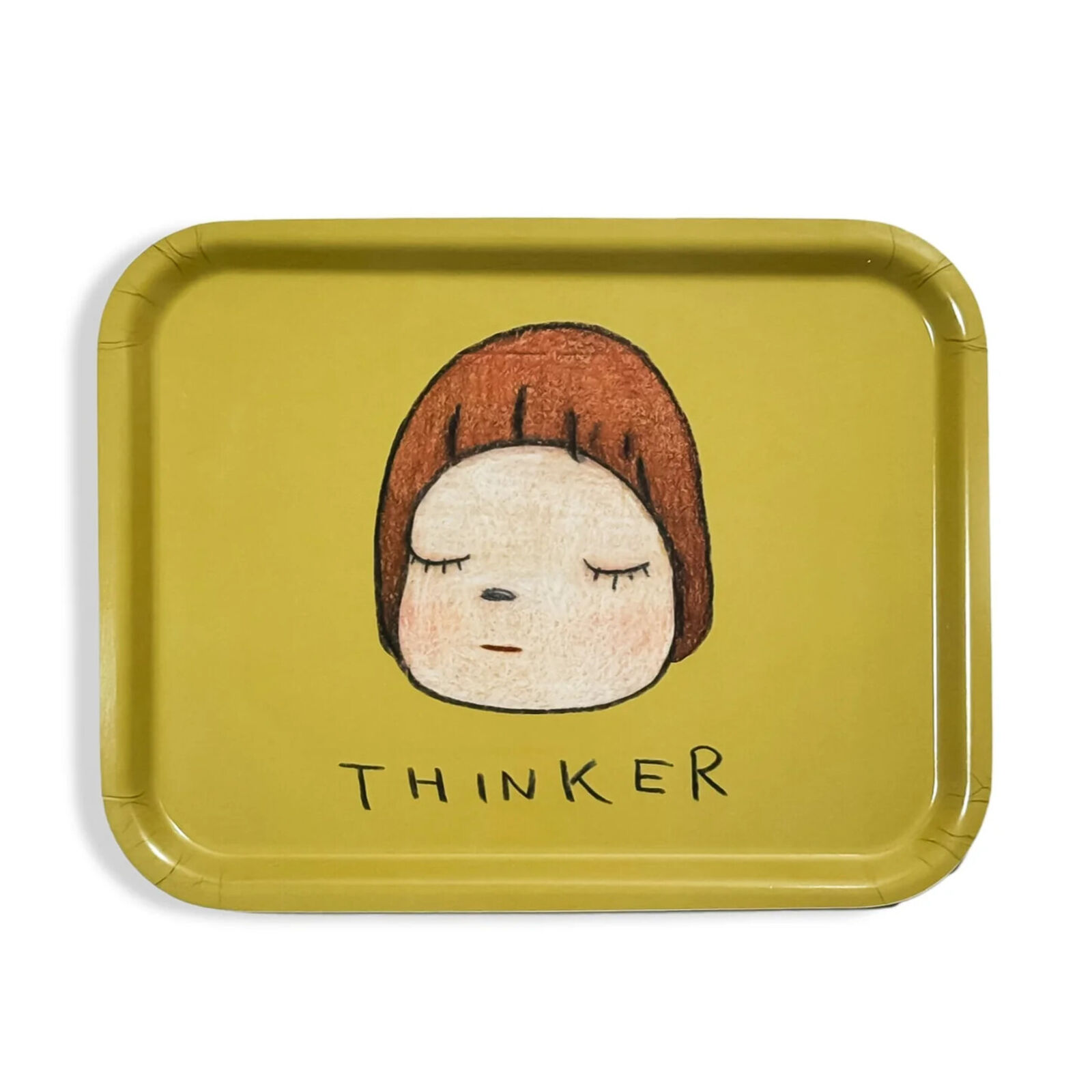 A yellow tray with a drawing of a girl's face on it.