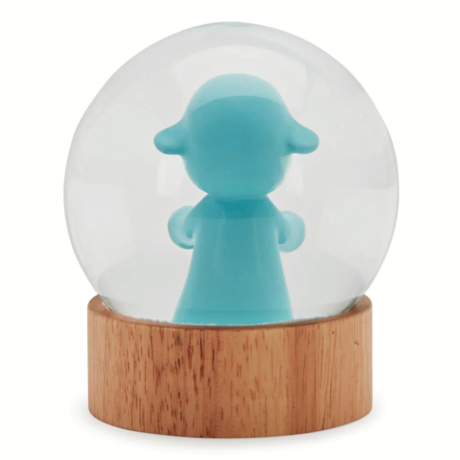 A snow globe with a little boy in a blue outfit.