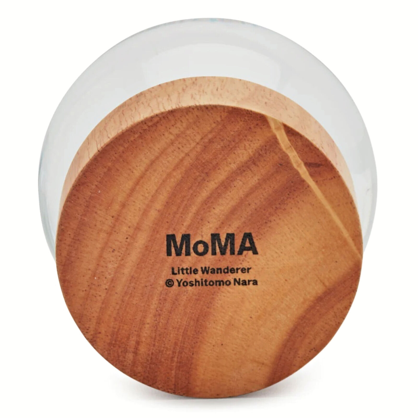 A snow globe with a little girl in a yellow dress.