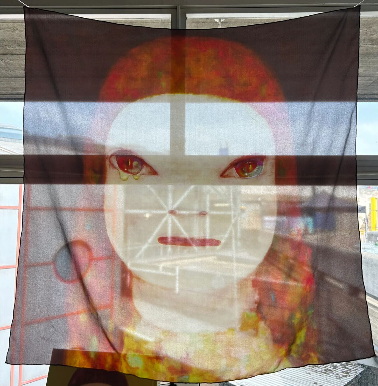 A painting of a doll with red hair and blue eyes.