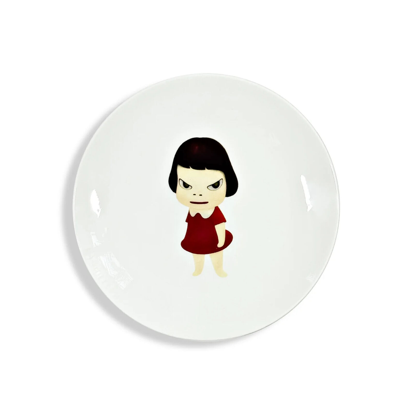 A white plate with a little girl in a red dress.