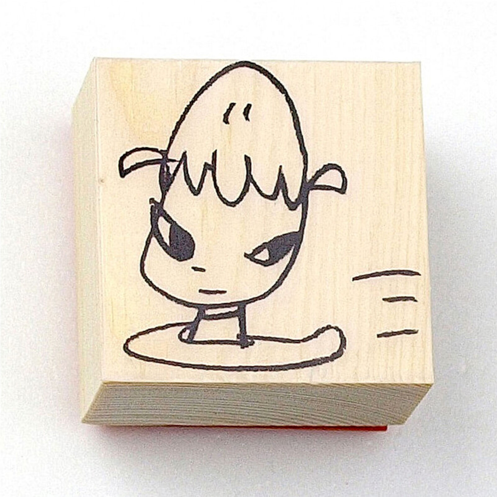 A rubber stamp with a drawing of a boy.
