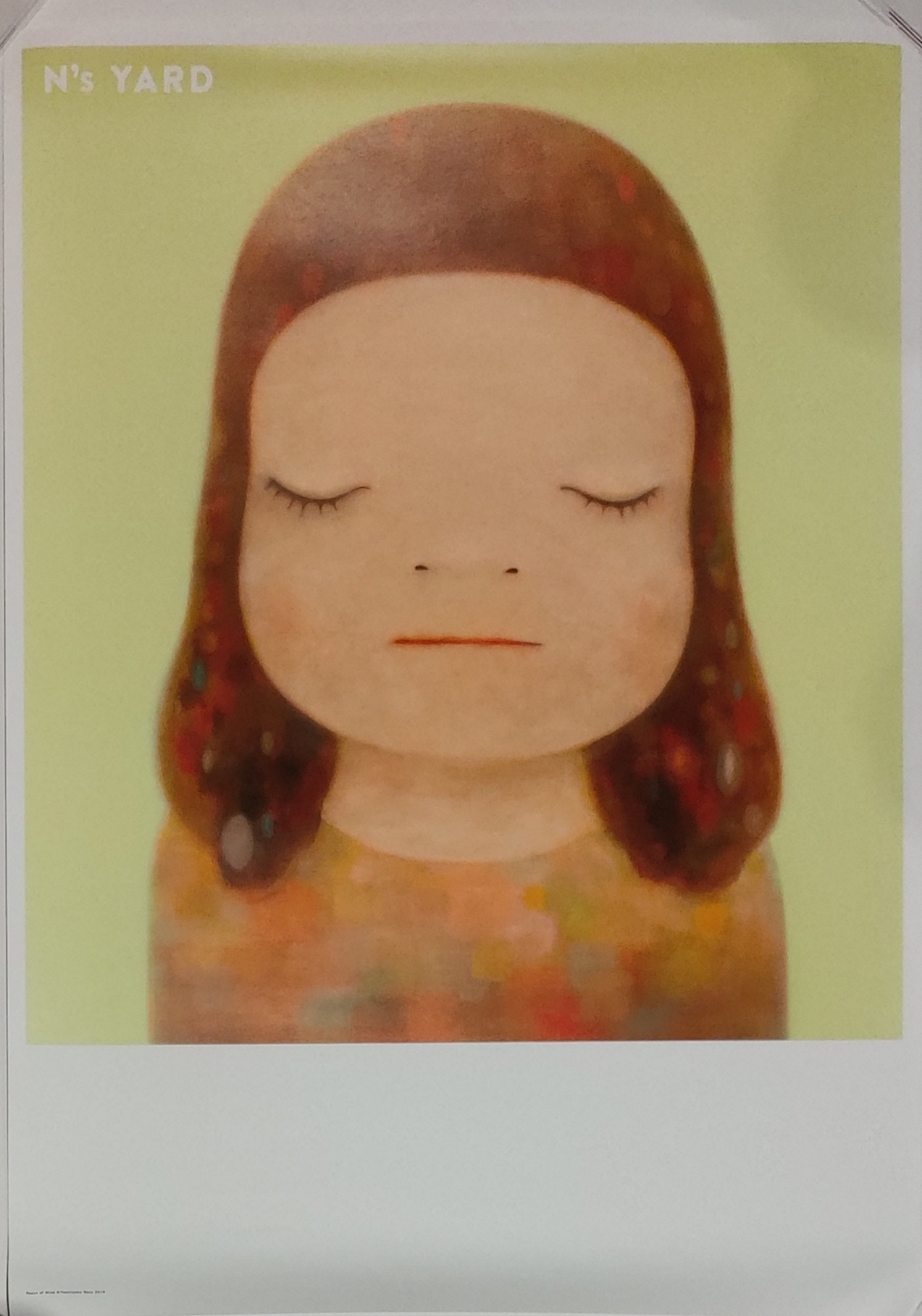 A picture of a girl with her eyes closed.