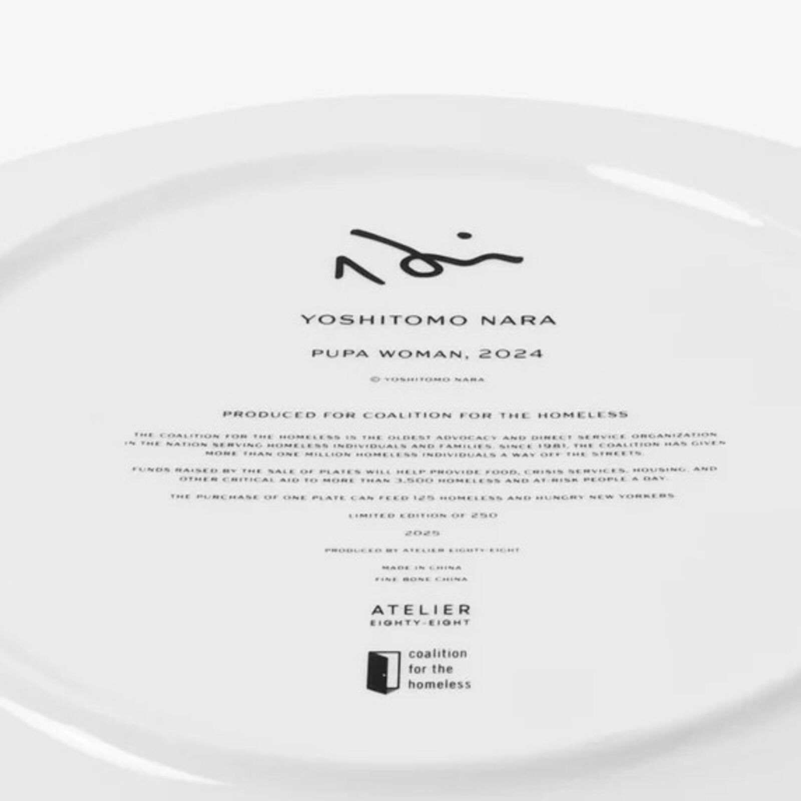 A white plate with a drawing of a girl's face.