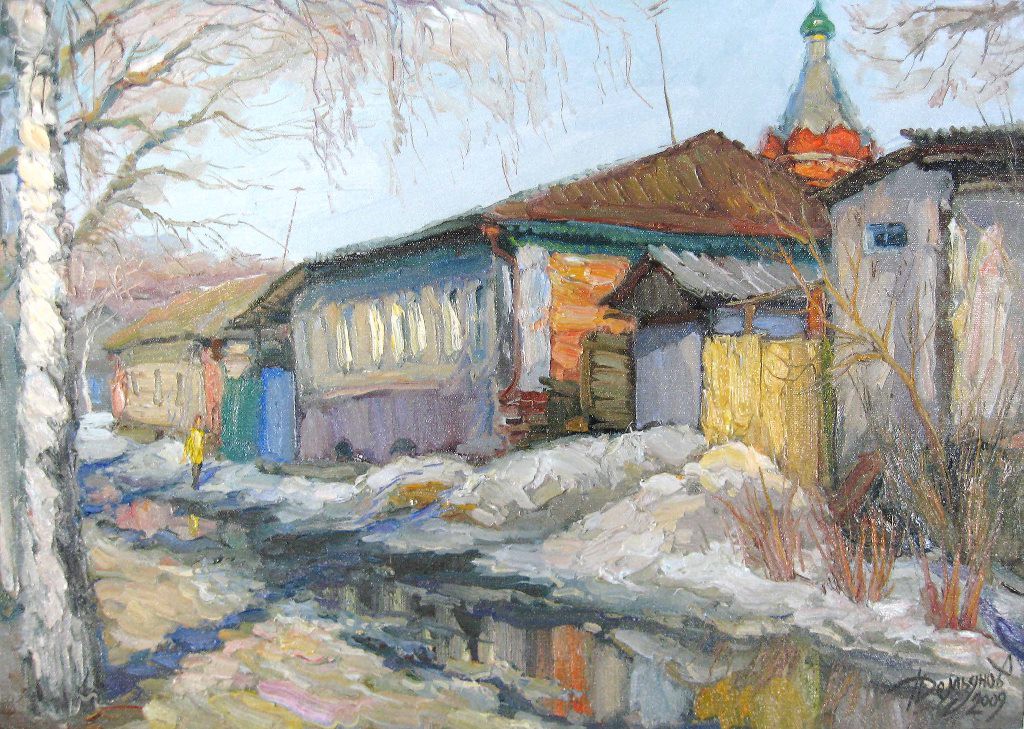 A winter street scene with a person in yellow walking past snow-covered houses and a church spire.
