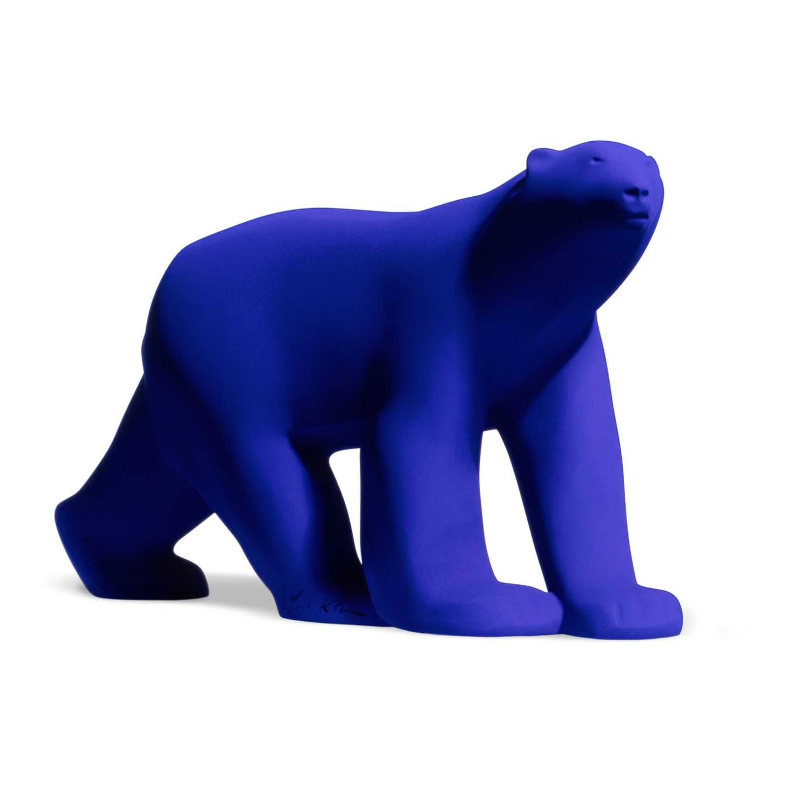 A smooth, matte blue sculpture of a four-legged animal in a walking pose.