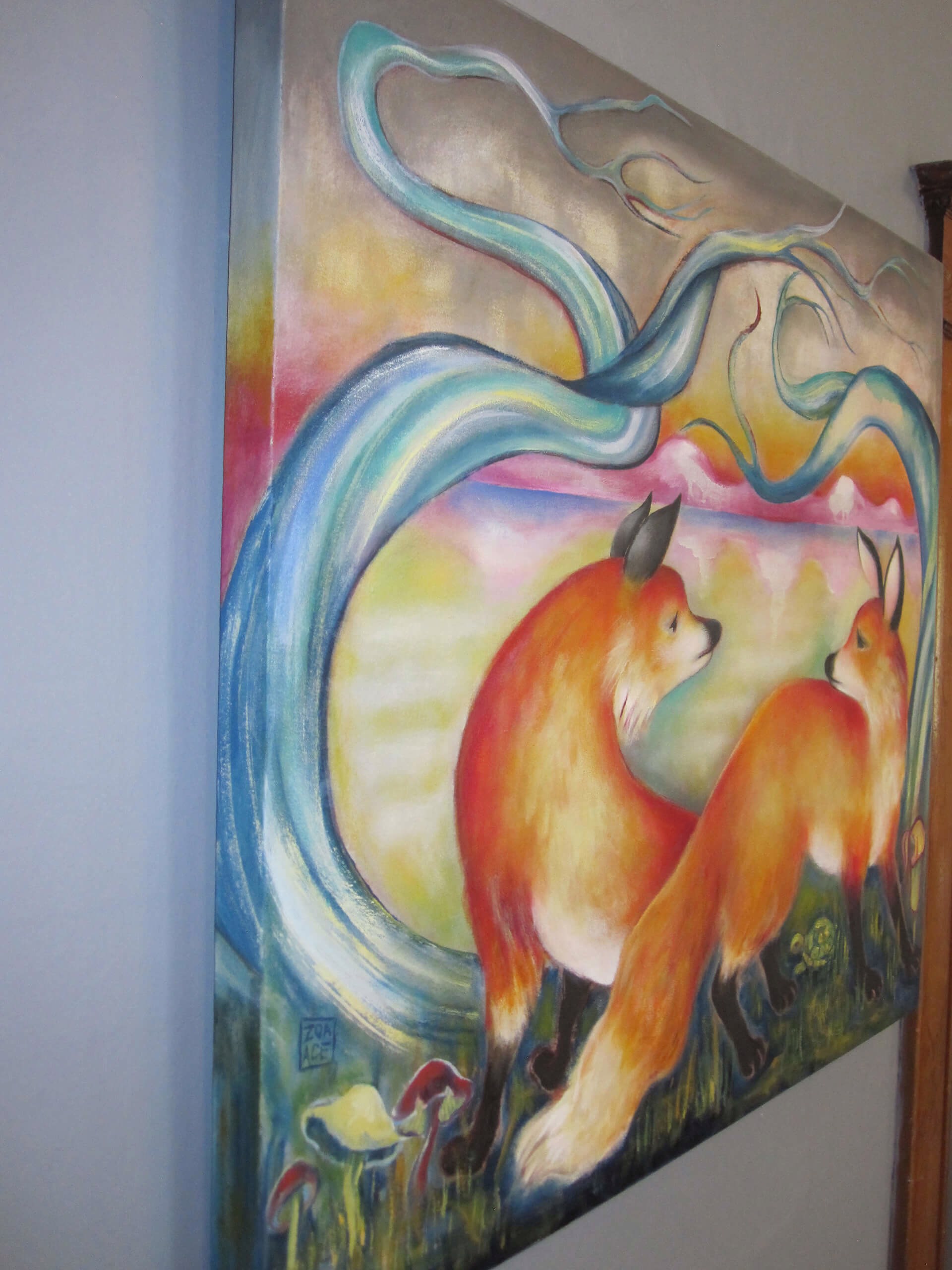 A painting of two foxes in a field of grass and trees.