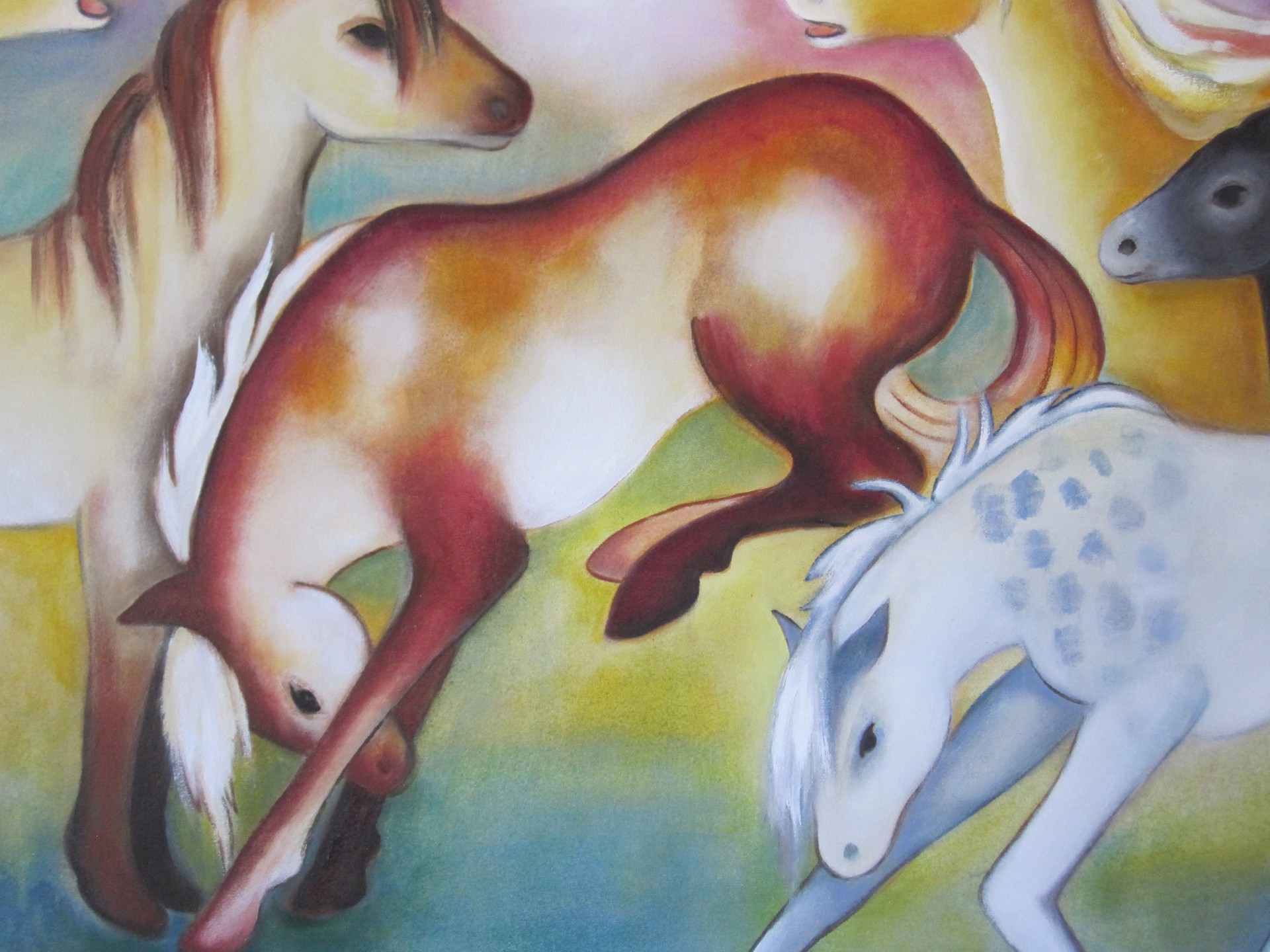 A painting of a group of horses running in a field.