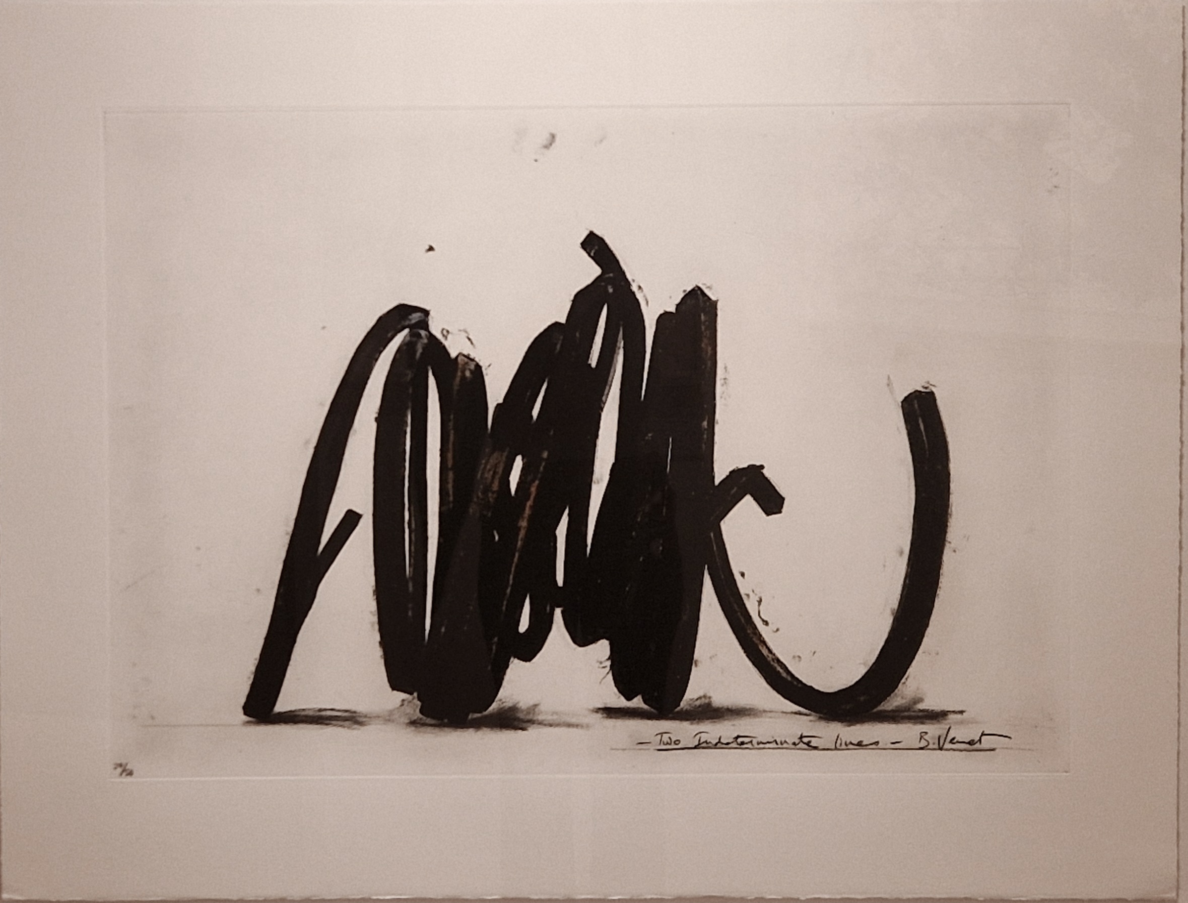 A black and white photo of the word Mark written in black ink.