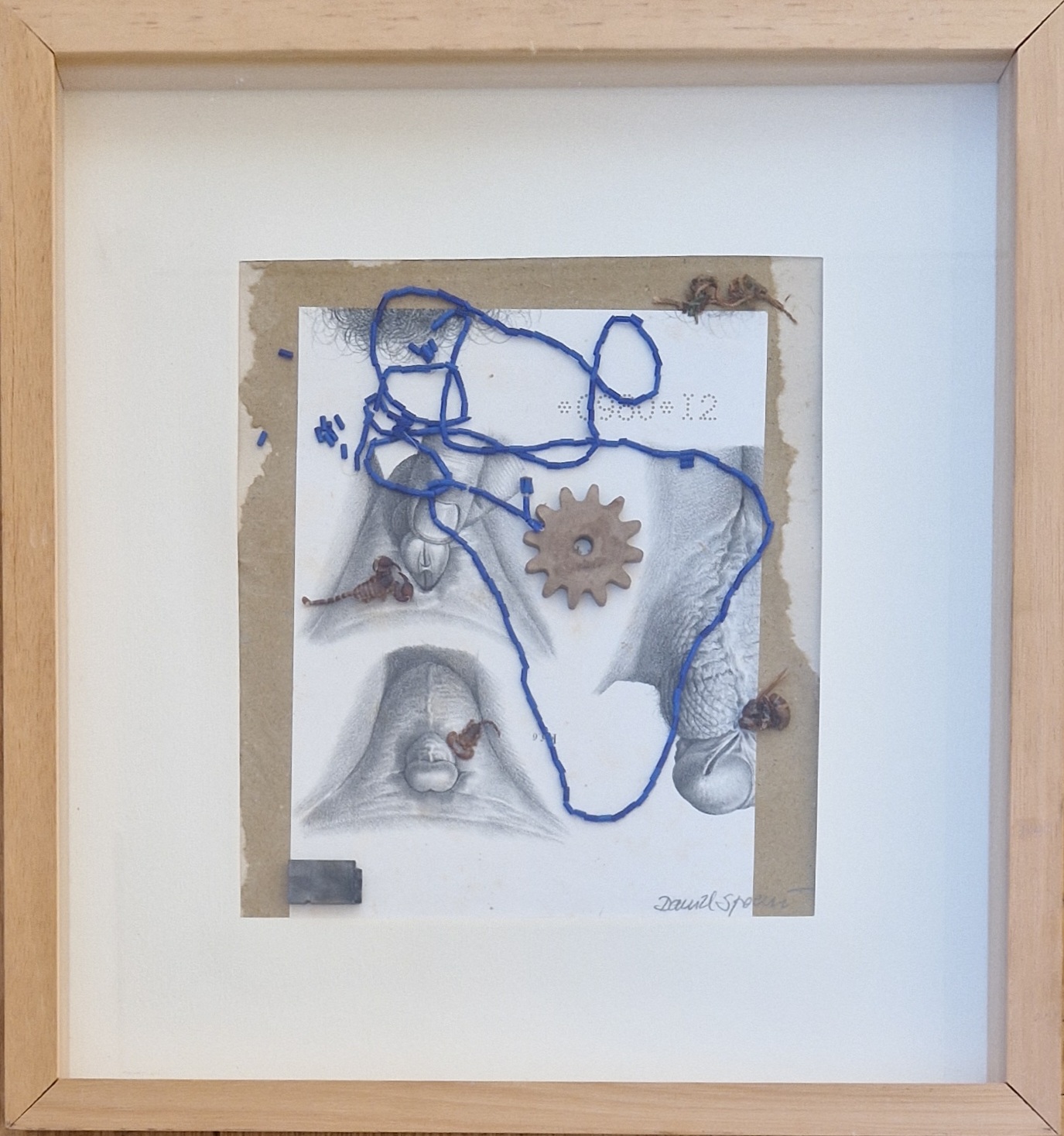 A drawing of a piece of paper with a blue string attached to it.