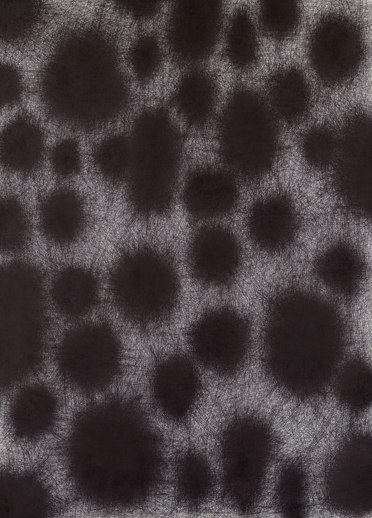 A monochromatic abstract composition featuring dark, textured circles on a light background.