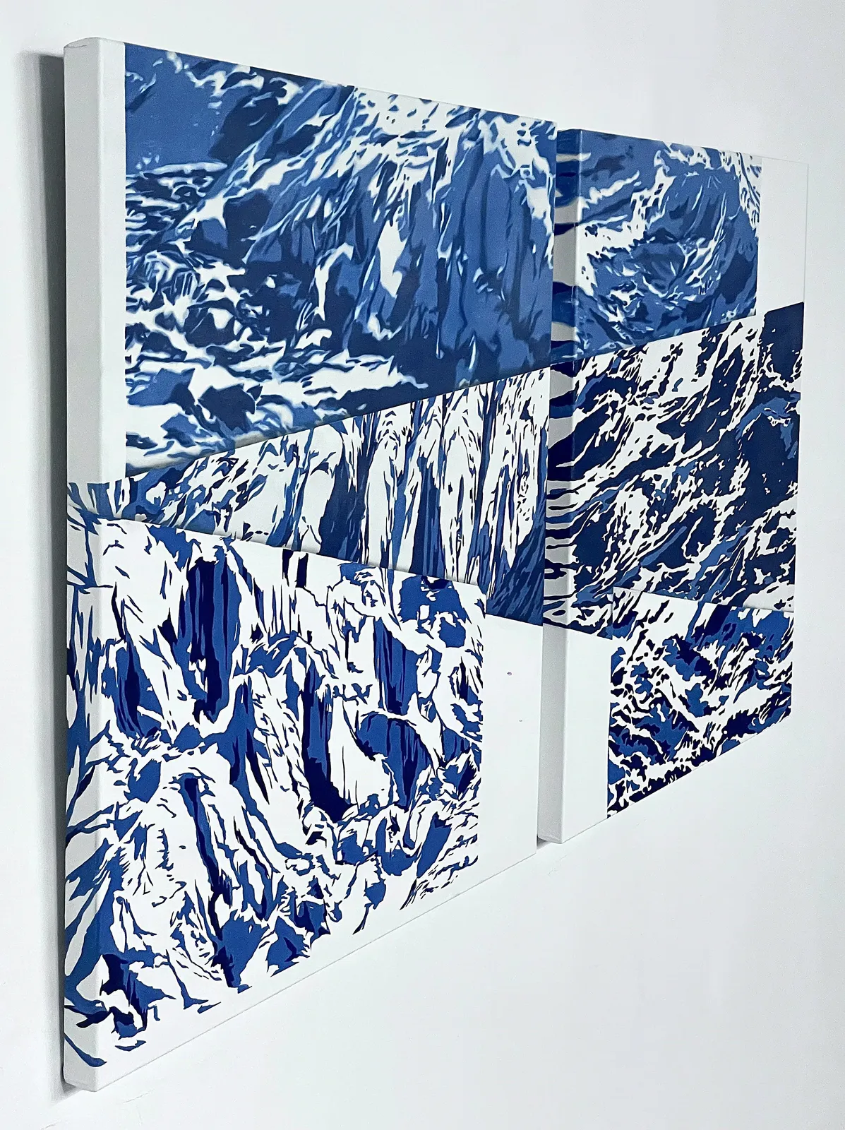 A blue and white painting of a mountain range.