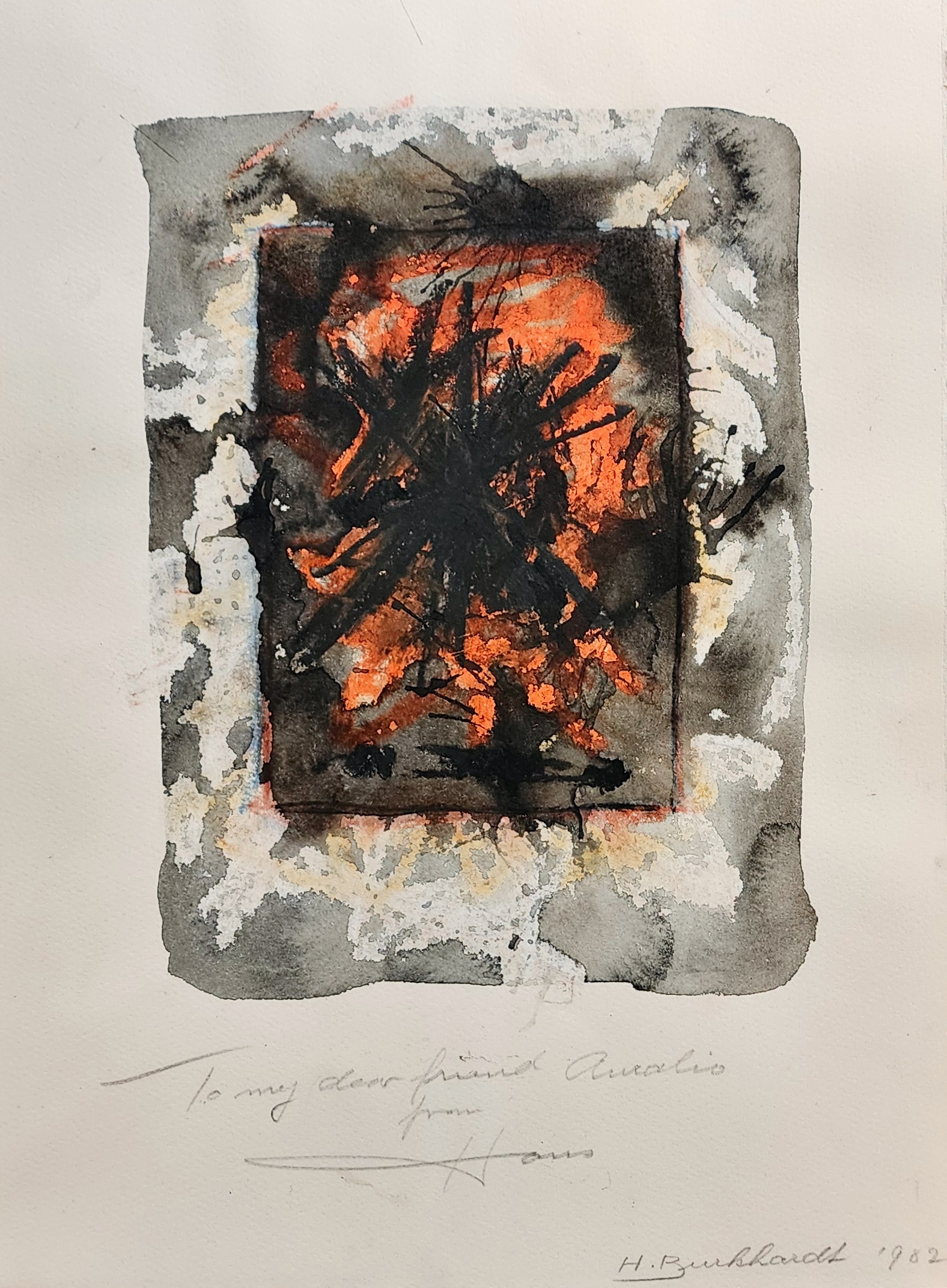 A black and orange painting on a piece of paper.