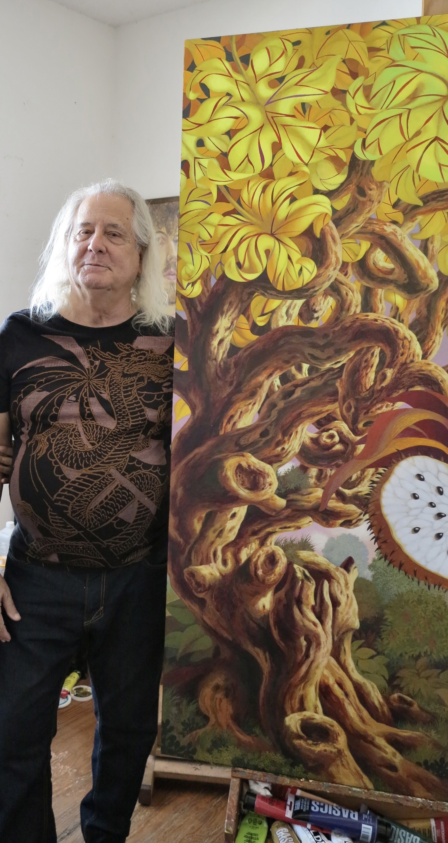 A painting of a papaya cut in half on a table.