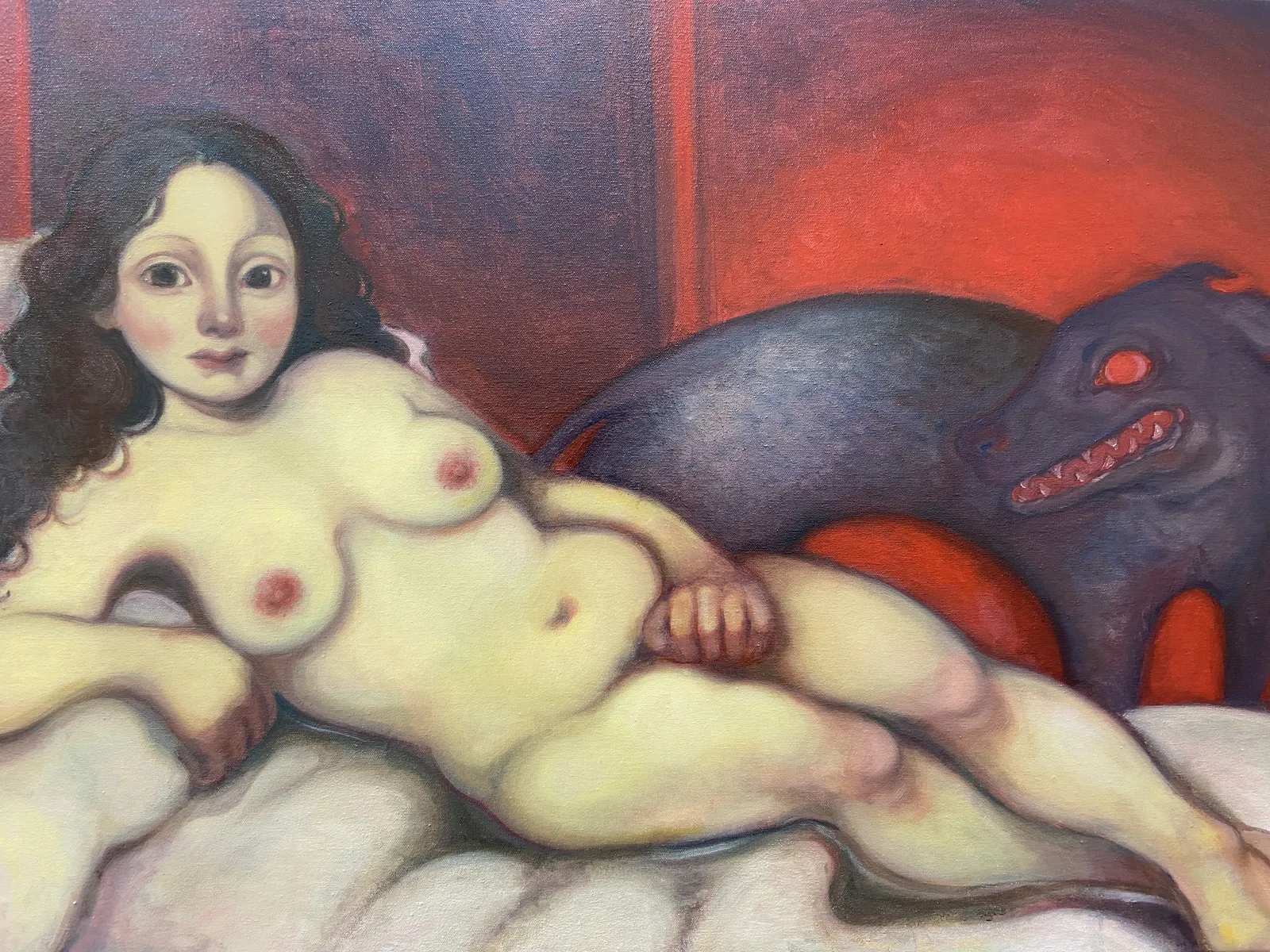 A painting of a nude woman laying on a bed next to a black dog.