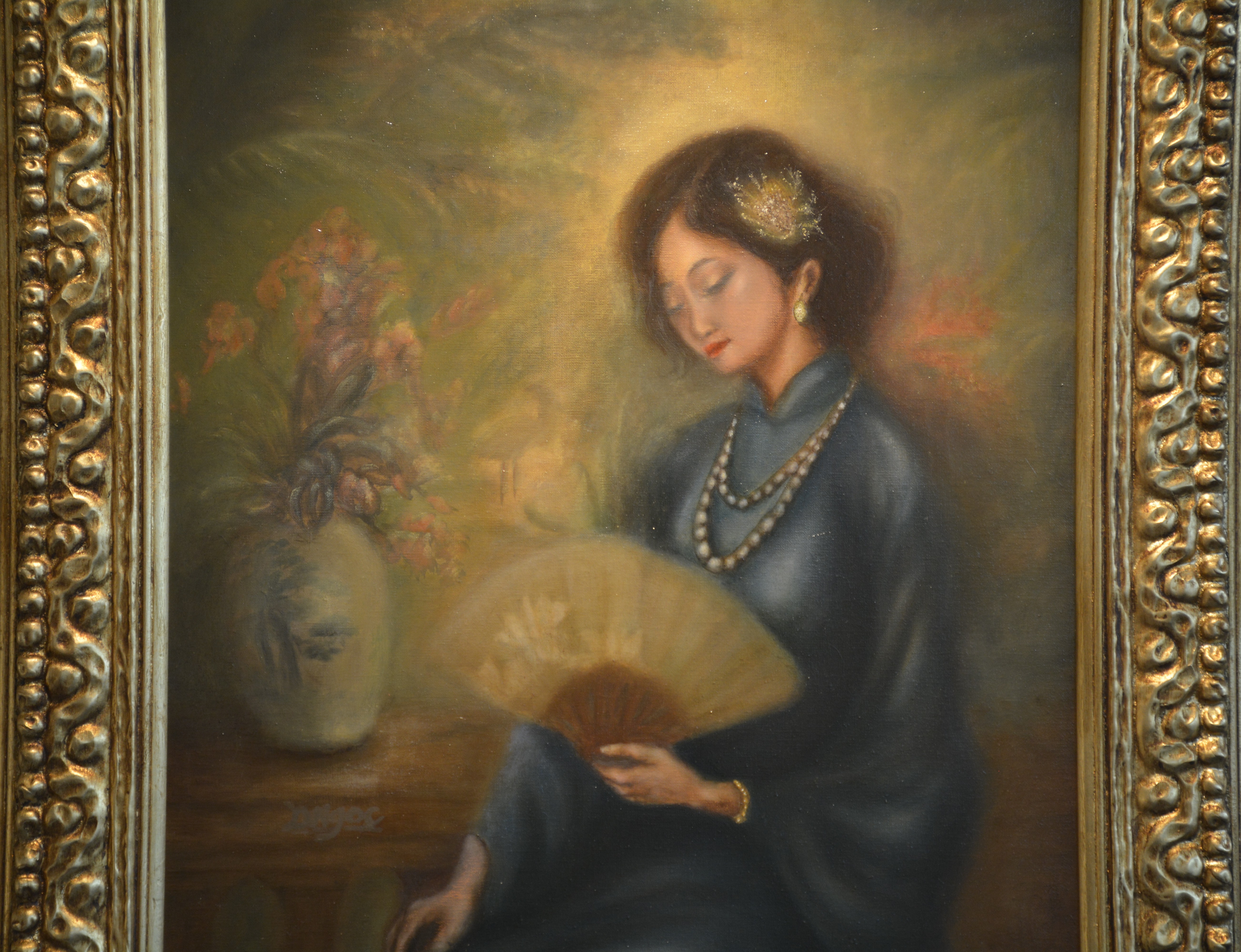 A serene portrait of a seated figure in a blue dress holding a fan, illuminated by a radiant golden glow.