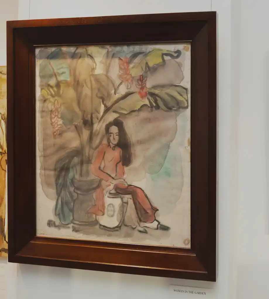A watercolor portrait of a seated figure in a tropical setting.