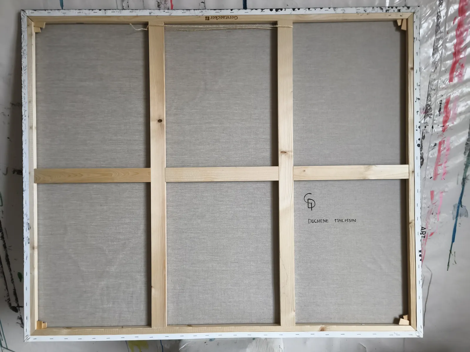 A painting of a deer in the woods surrounded by flowers.