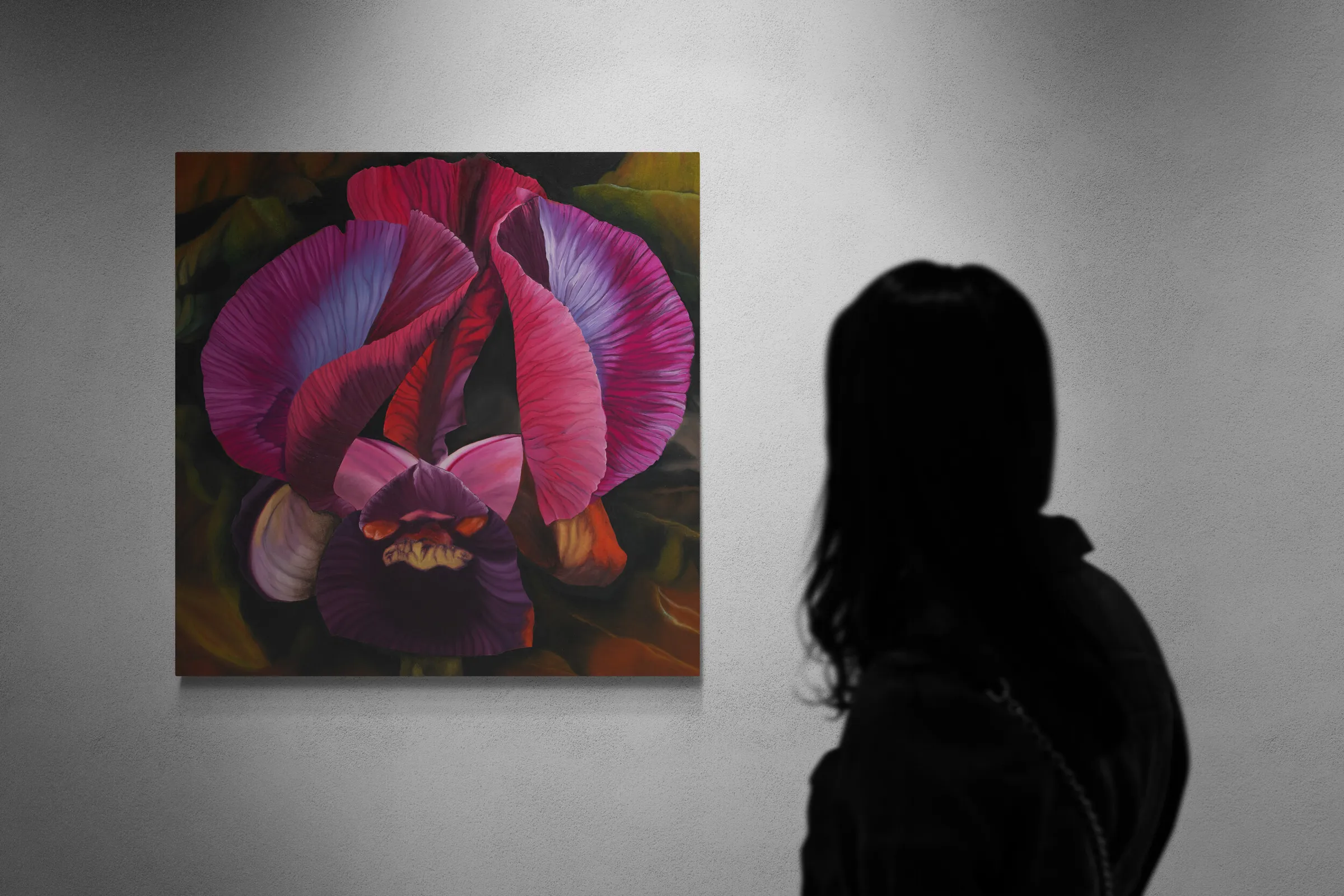 A painting of two purple and red iris flowers on a black background.