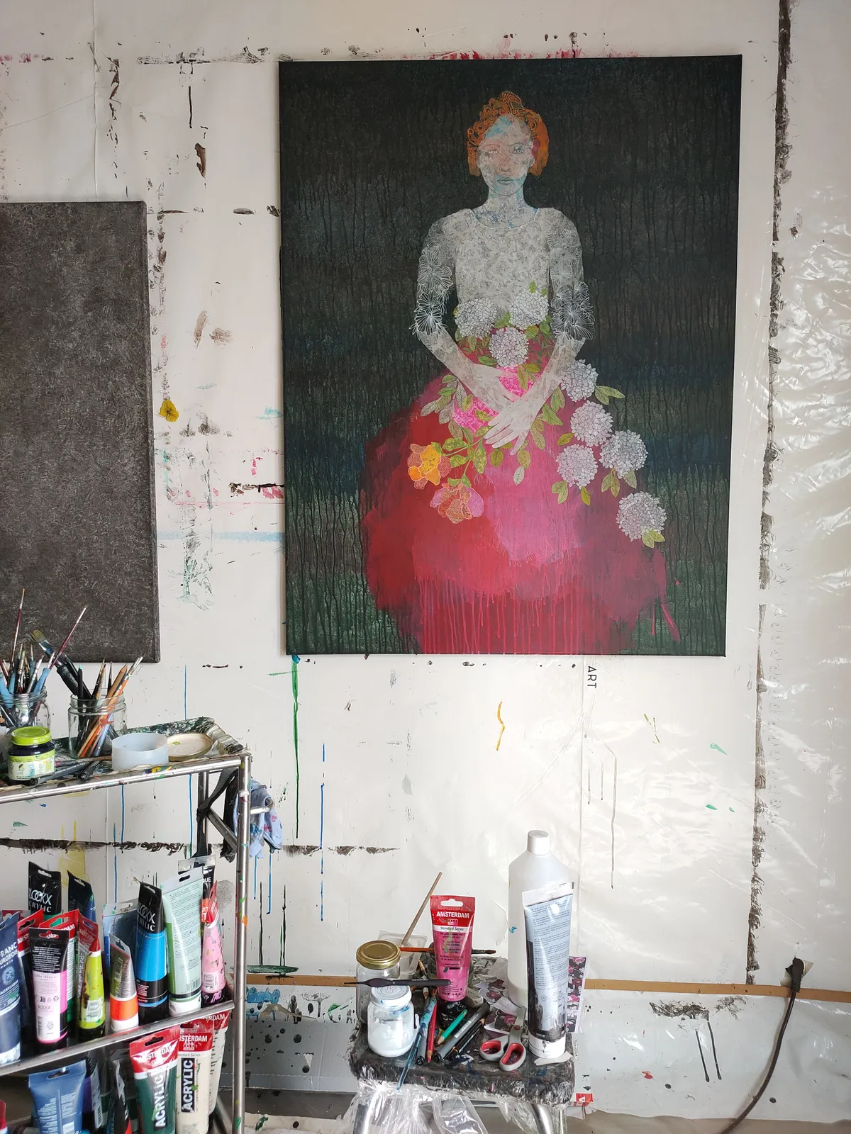 A painting of a woman in a red dress holding flowers.