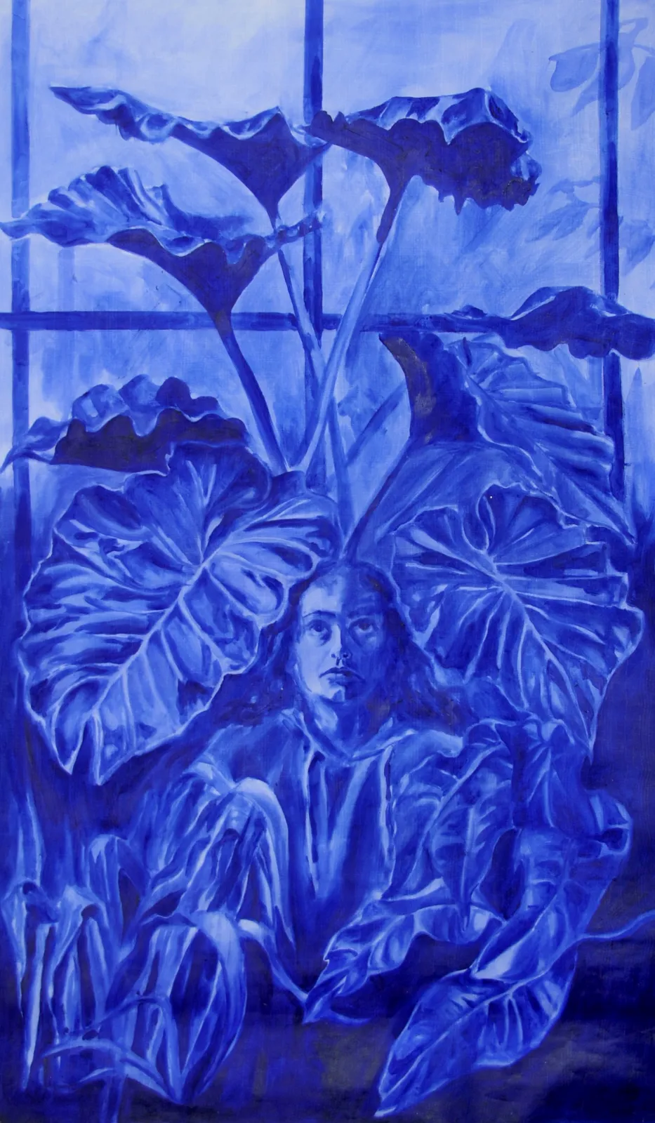 A monochromatic blue portrait of a figure emerging from large tropical leaves.