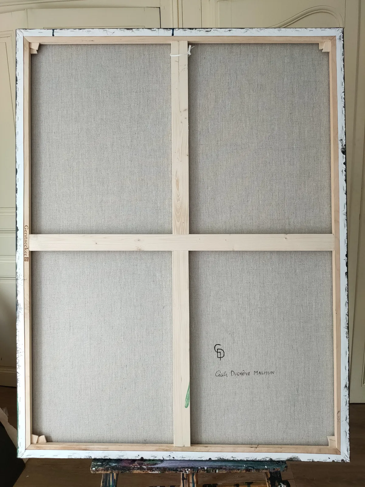 A painting of a woman in a red dress holding flowers.